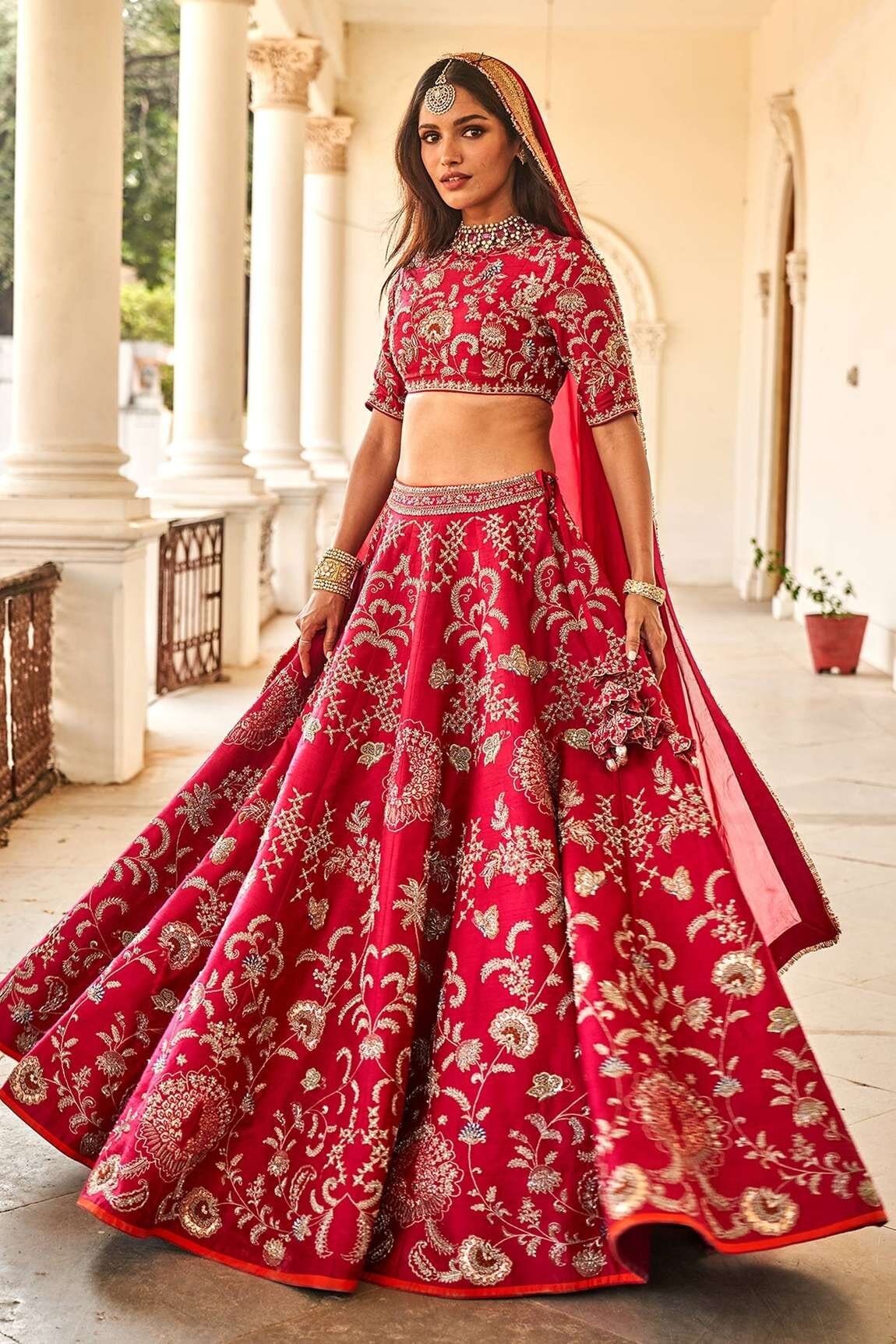 destination wedding bright pink bridal lehengas from Jayanti Reddy