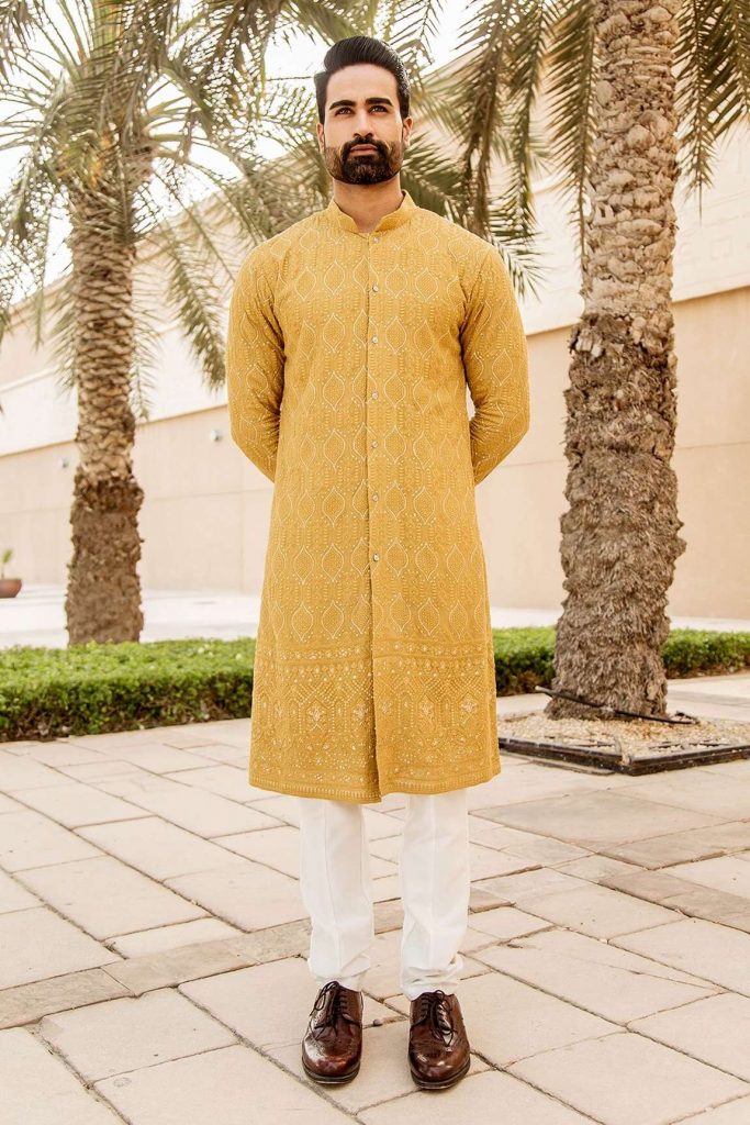 yellow lucknowi embroidered kurta and salwar set from Soniya G. diwali couple outfit ideas