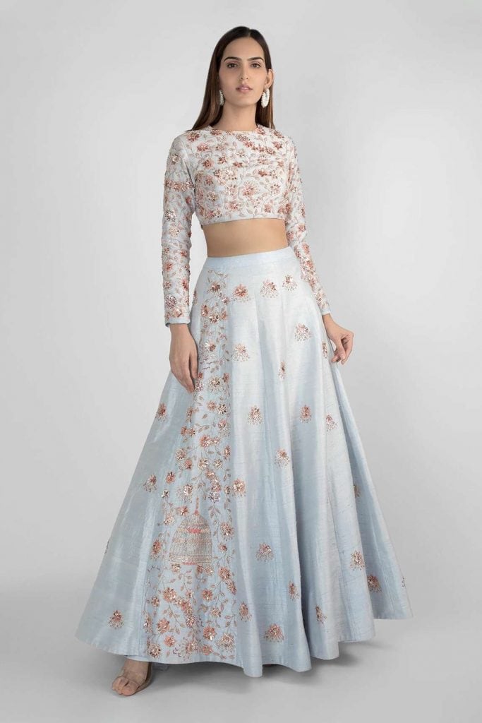 Pink Peacock Couture's Blue Raw Silk Embellished Crop Top And designer Lehenga Set for festive season. Diwali couple outfit ideas 2022