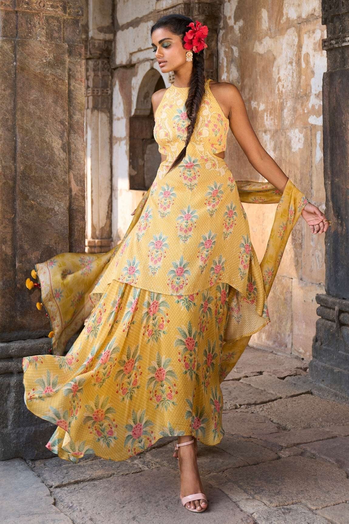 Yellow floral print kurta skirt set from Anita Dongre with tassel dupatta, paradise found collection