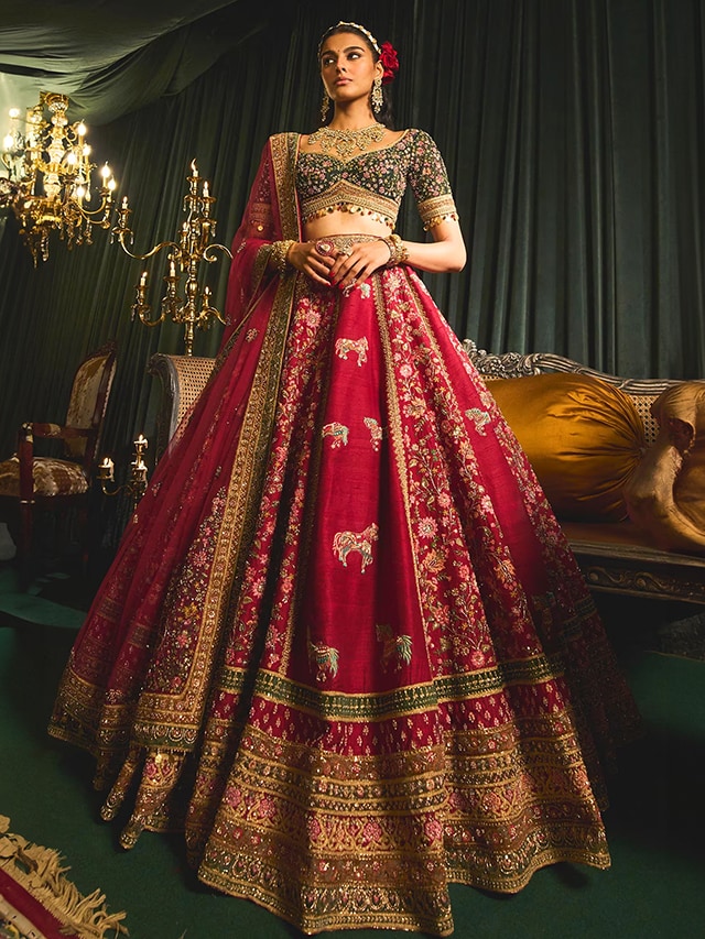 Red Bridal Lehenga Trends: Red is officially back in the wedding scene with statement bridal lehengas at Aza Fashions